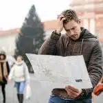 Do They Speak English in Medellín? (And Do You Need Spanish?) 49258040 – lost tourist looking at city map on a trip. looking for directions.